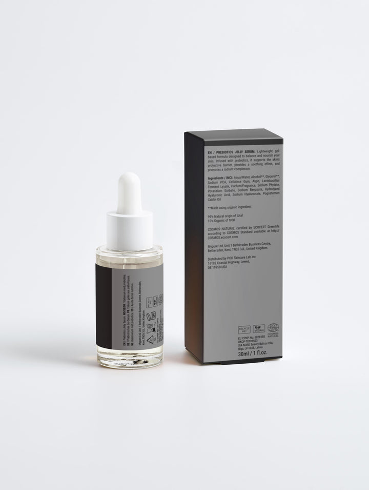 Skincare serum bottle with dropper and packaging on a light gray background