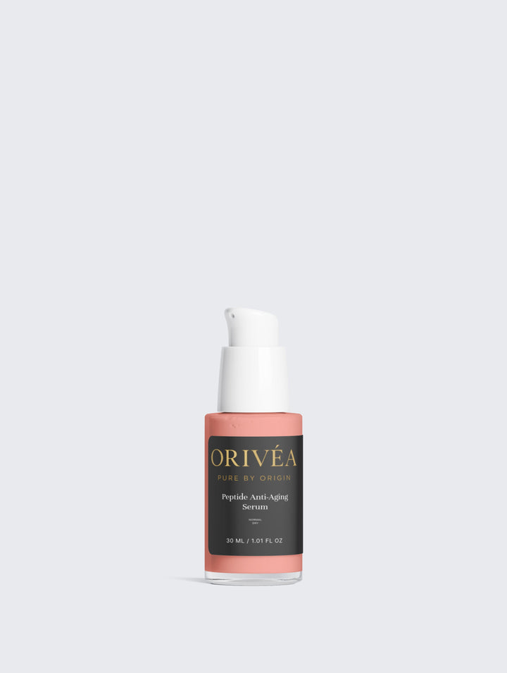 Orivea skincare serum bottle on a light gray background